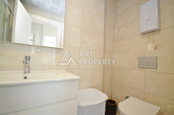 Квартира 2+1 с видом на море в Махмутларе, 80 кв.м. - Ракурс 15