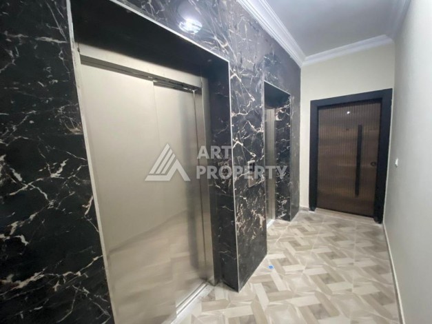 Дуплекс 2+1 в центре Махмутлара, 120 кв.м. Новый ЖК. - Ракурс 20