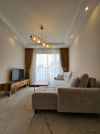 Меблированная квартира 1+1 в новой резиденции, 55 кв.м. в Махмутларе. - Ракурс 2