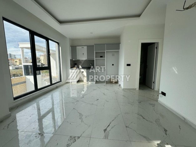 Современная квартира 1+1 в центре Махмутлара, 50 кв.м. - Ракурс 9