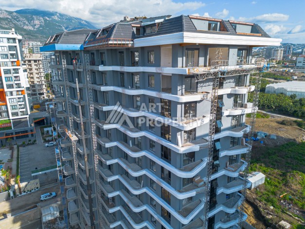 Квартира 2+1 в элитной новой резиденции, 600 м от моря в Махмутларе - Ракурс 13