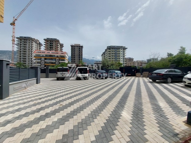 Три квартиры 1+1 в центре Махмутлара, 54-56 кв.м - Ракурс 5