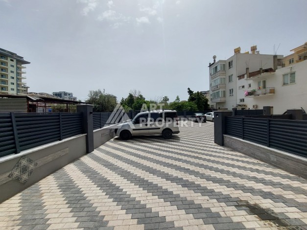 Три квартиры 1+1 в центре Махмутлара, 54-56 кв.м - Ракурс 6