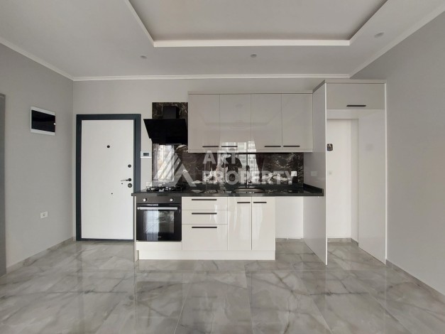 Три квартиры 1+1 в центре Махмутлара, 54-56 кв.м - Ракурс 8