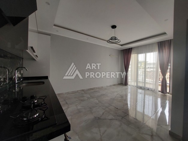 Три квартиры 1+1 в центре Махмутлара, 54-56 кв.м - Ракурс 10