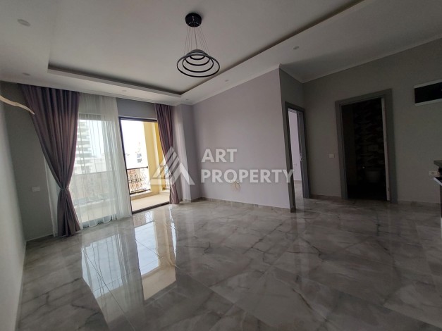 Три квартиры 1+1 в центре Махмутлара, 54-56 кв.м - Ракурс 12