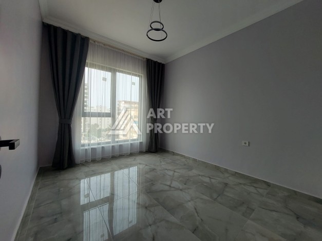 Три квартиры 1+1 в центре Махмутлара, 54-56 кв.м - Ракурс 13