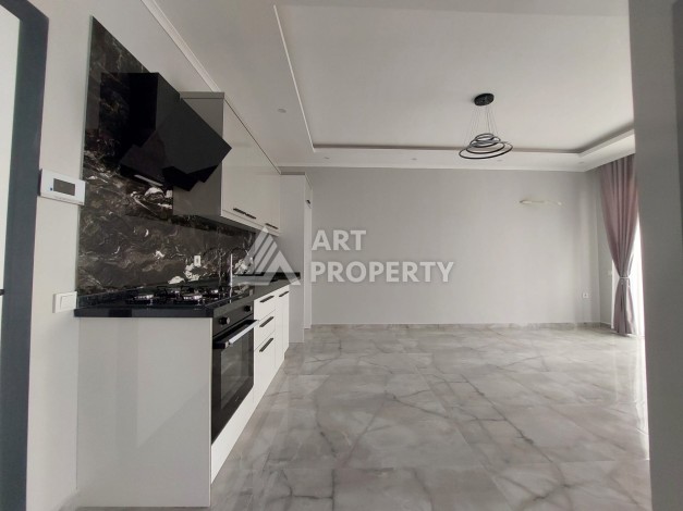 Три квартиры 1+1 в центре Махмутлара, 54-56 кв.м - Ракурс 16