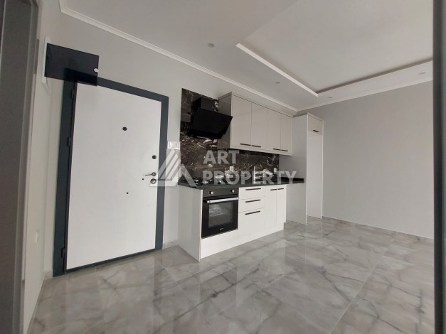 Три квартиры 1+1 в центре Махмутлара, 54-56 кв.м - Ракурс 17