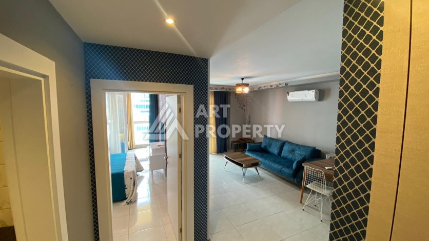 Меблированная квартира 1+1 в резиденции с отельной инфраструктурой в Махмутларе, 50 кв.м. - Ракурс 15