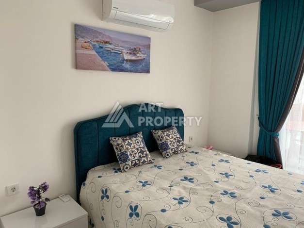 Меблированная квартира 1+1 в резиденции с отельной инфраструктурой в Махмутларе, 50 кв.м. - Ракурс 22