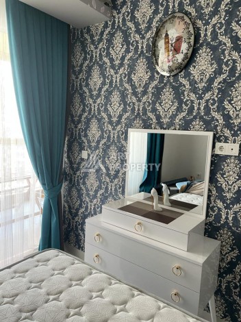 Меблированная квартира 1+1 в резиденции с отельной инфраструктурой в Махмутларе, 50 кв.м. - Ракурс 23