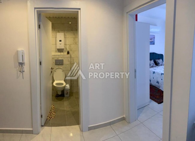 Меблированная квартира 1+1 в резиденции с отельной инфраструктурой в Махмутларе, 50 кв.м. - Ракурс 25