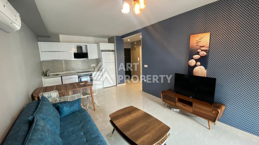 Меблированная квартира 1+1 в резиденции с отельной инфраструктурой в Махмутларе, 50 кв.м. - Ракурс 30