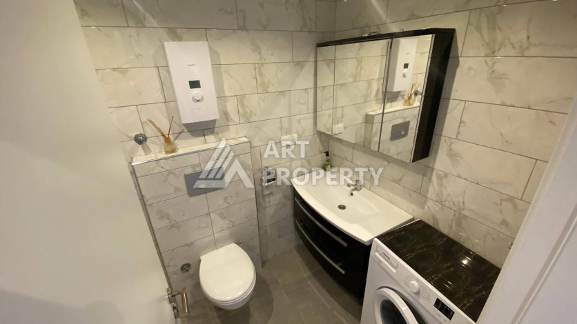 Меблированная квартира 1+1 в резиденции с отельной инфраструктурой в Махмутларе, 50 кв.м. - Ракурс 32