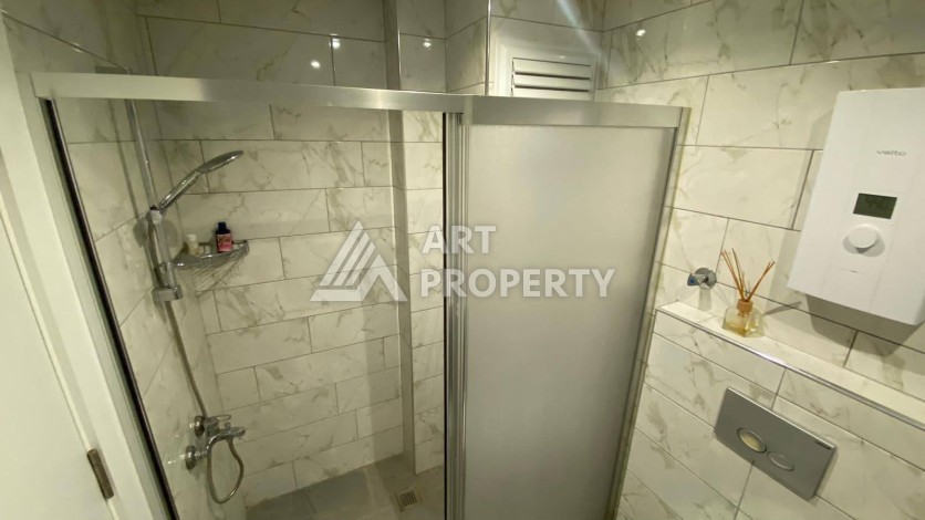 Меблированная квартира 1+1 в резиденции с отельной инфраструктурой в Махмутларе, 50 кв.м. - Ракурс 33