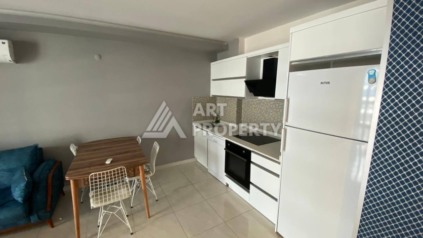 Меблированная квартира 1+1 в резиденции с отельной инфраструктурой в Махмутларе, 50 кв.м. - Ракурс 34