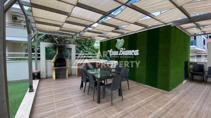 Меблированная квартира 1+1 в резиденции с отельной инфраструктурой в Махмутларе, 50 кв.м. - Ракурс 54