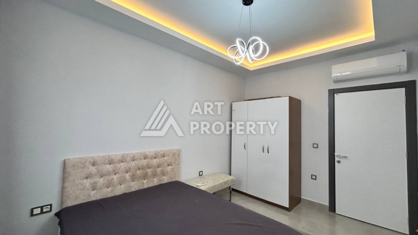 Квартира 1+1 с мебелью в хорошем ЖК, 55 кв.м. Махмутлар, Алания - Ракурс 7
