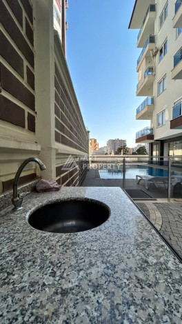 Квартира 1+1 с мебелью в хорошем ЖК, 55 кв.м. Махмутлар, Алания - Ракурс 27
