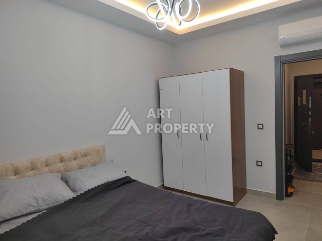 Квартира 1+1 с мебелью в хорошем ЖК, 55 кв.м. Махмутлар, Алания - Ракурс 46