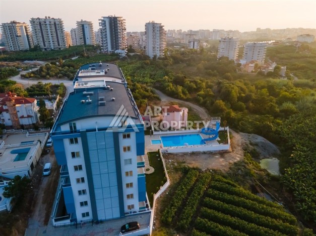 Квартира 1+1 в престижном комплексе района Махмутлар, 60 кв.м. - Ракурс 11