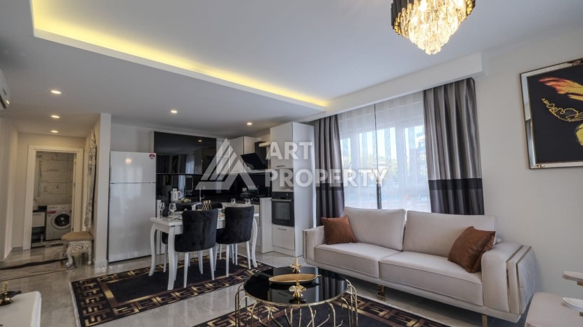 Квартира 1+1 с мебелью в Махмутларе, 70 кв.м. - Ракурс 2