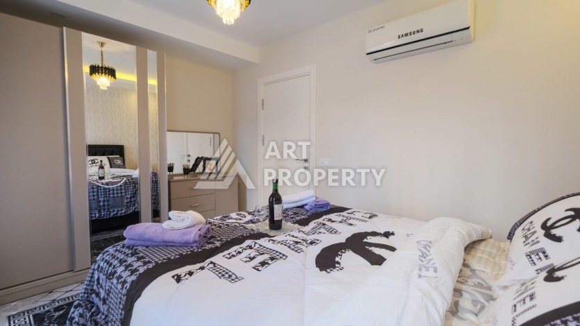 Квартира 1+1 с мебелью в Махмутларе, 70 кв.м. - Ракурс 10