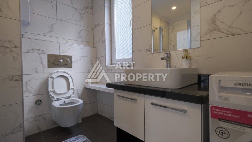 Квартира 1+1 с мебелью в Махмутларе, 70 кв.м. - Ракурс 11