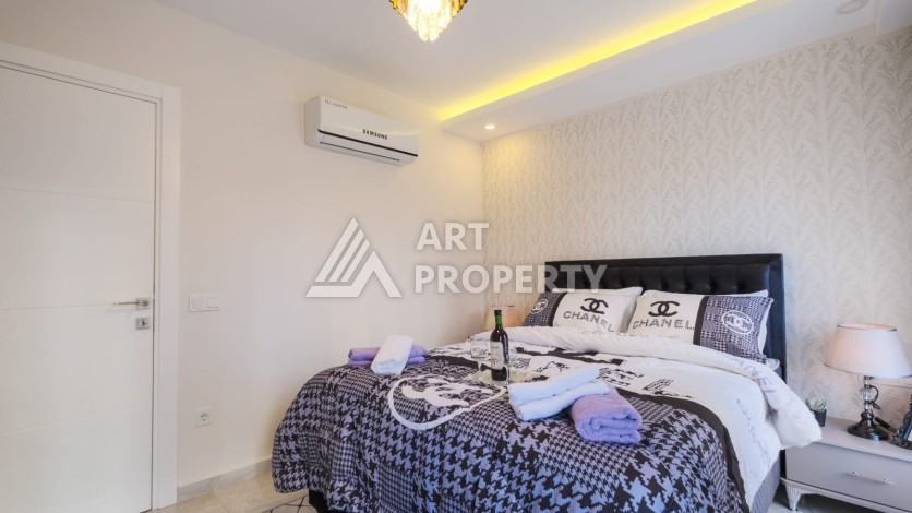 Квартира 1+1 с мебелью в Махмутларе, 70 кв.м. - Ракурс 13