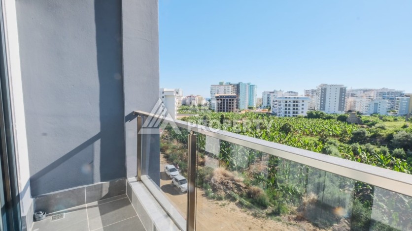 Квартира 1+1 в Махмутларе рядом с Наулой, 55 кв.м. - Ракурс 8