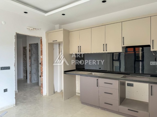 Стильная квартира 1+1 в элитном жилом комплексе в центре Махмутлара, 52 кв.м. - Ракурс 6