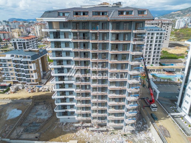 Стильная квартира 1+1 в элитном жилом комплексе в центре Махмутлара, 52 кв.м. - Ракурс 41