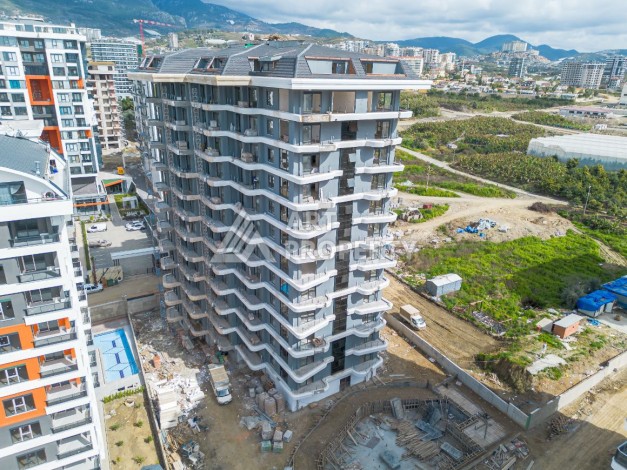 Стильная квартира 1+1 в элитном жилом комплексе в центре Махмутлара, 52 кв.м. - Ракурс 42