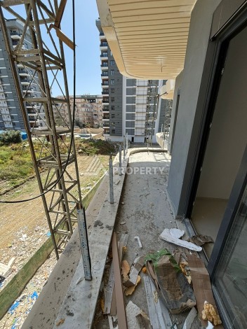 Стильная квартира 1+1 в элитном жилом комплексе в центре Махмутлара, 52 кв.м. - Ракурс 43