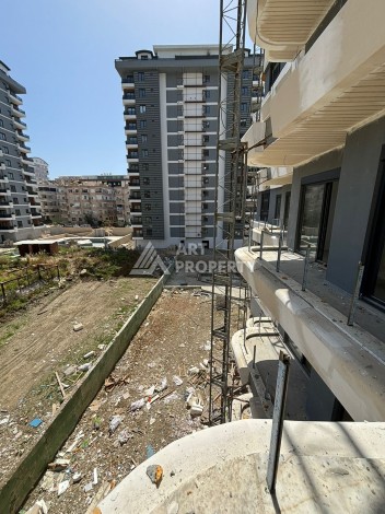 Стильная квартира 1+1 в элитном жилом комплексе в центре Махмутлара, 52 кв.м. - Ракурс 44