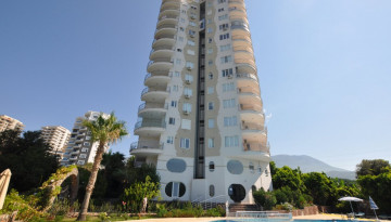 Меблированная квартира 2+1 с частичным видом на море в районе Махмутлар, 115 м2 - Ракурс 1