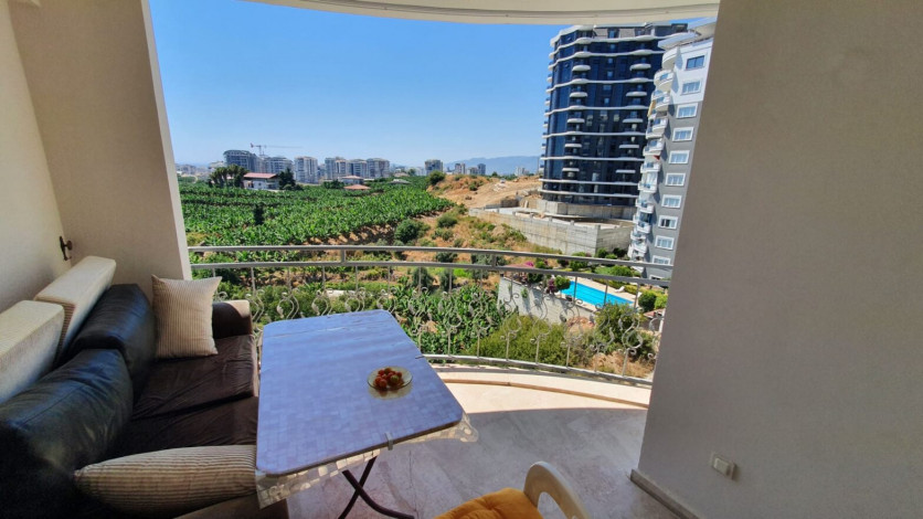 Меблированная квартира 2+1 с частичным видом на море в районе Махмутлар, 115 м2 - Ракурс 2