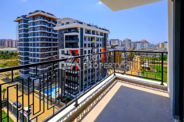 Квартира 1+1 в новой резиденции в центре Махмутлара, 55 кв.м. - Ракурс 2