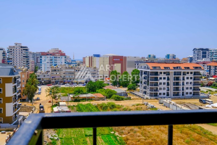 Квартира 1+1 в новой резиденции в центре Махмутлара, 55 кв.м. - Ракурс 3