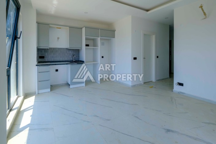 Квартира 1+1 в новой резиденции в центре Махмутлара, 55 кв.м. - Ракурс 7