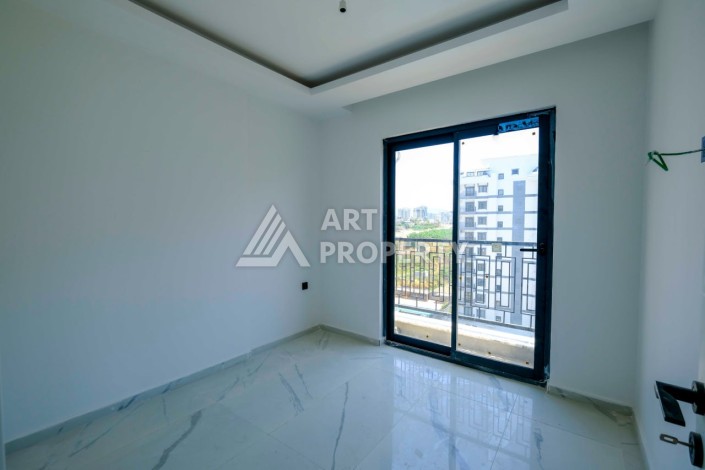 Квартира 1+1 в новой резиденции в центре Махмутлара, 55 кв.м. - Ракурс 10