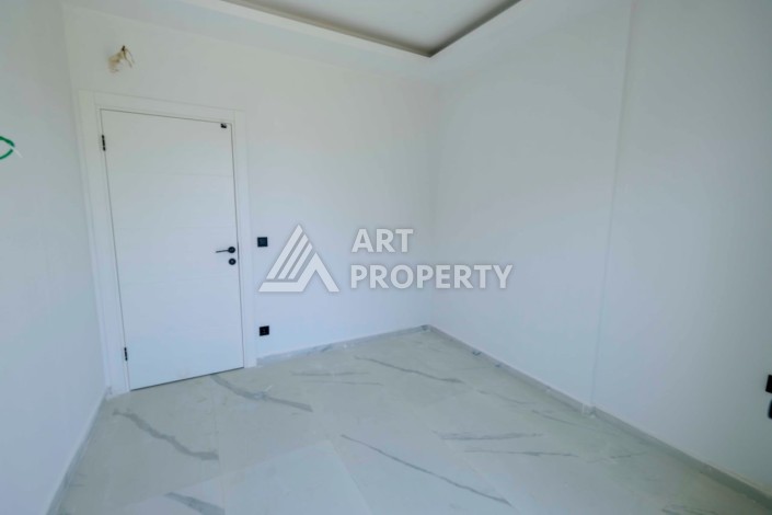 Квартира 1+1 в новой резиденции в центре Махмутлара, 55 кв.м. - Ракурс 12