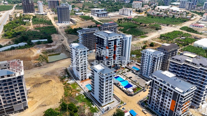 Квартира 1+1 в новой резиденции в центре Махмутлара, 55 кв.м. - Ракурс 14