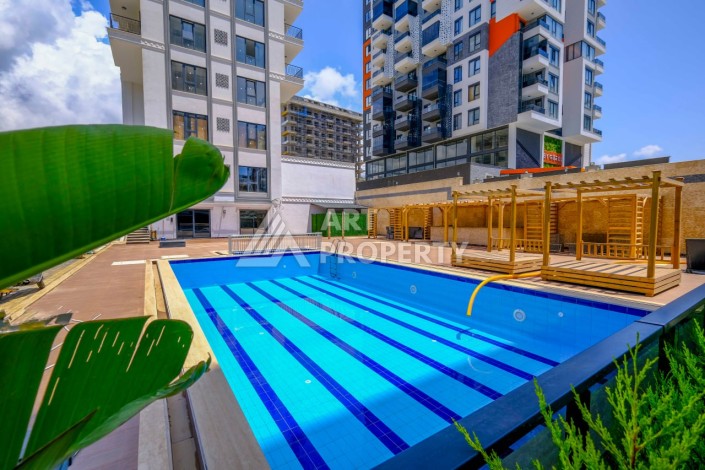 Квартира 1+1 в новой резиденции в центре Махмутлара, 55 кв.м. - Ракурс 18