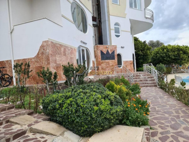 Меблированная квартира 2+1 с частичным видом на море в районе Махмутлар, 115 м2 - Ракурс 18