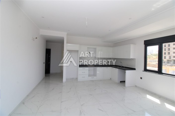 Квартира 2+1 в новом доме, 90 кв.м. Центр Махмутлара - Ракурс 2