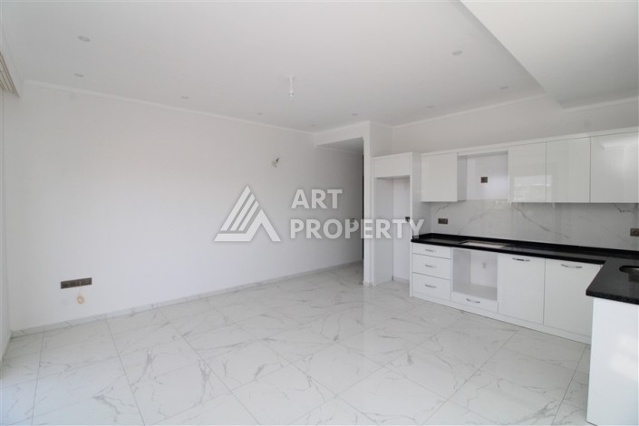 Квартира 2+1 в новом доме, 90 кв.м. Центр Махмутлара - Ракурс 3