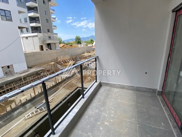 Современная квартира 1+1 с просторной планировкой 60 кв.м. в Махмутларе - Ракурс 14