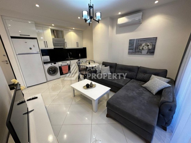 Квартира 1+1 в престижной резиденции Махмутлара, 55 кв.м. - Ракурс 2